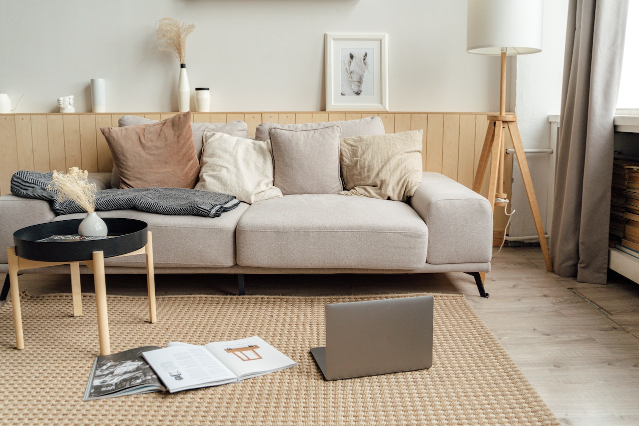 Black Laptop Computer on Brown Wooden Table