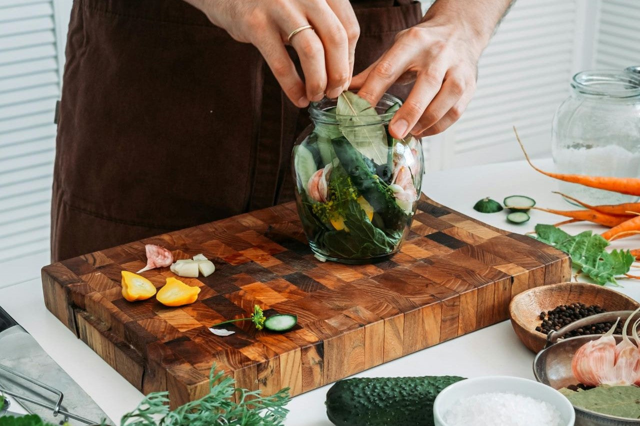 Man using edge-grain cutting board for chopping vegetables 