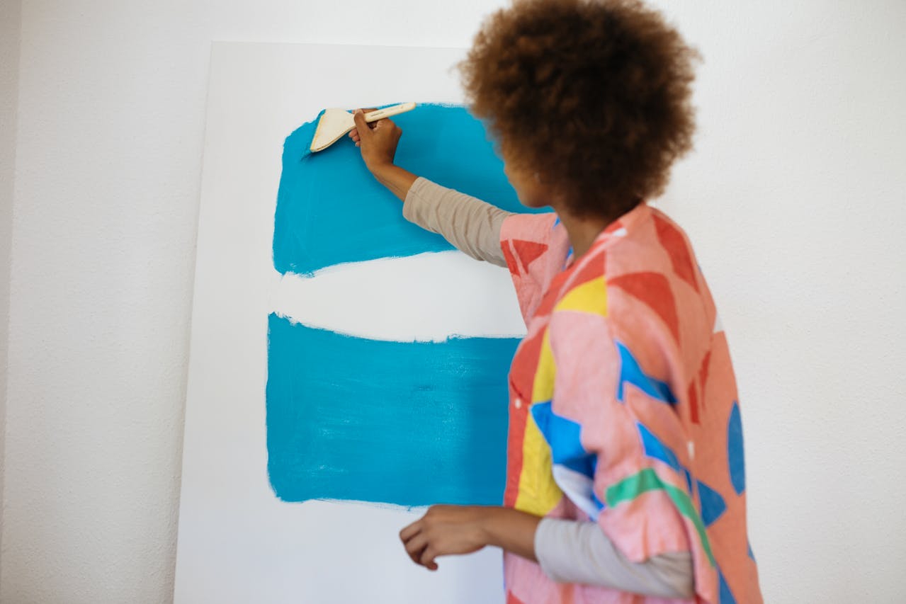 Woman Painting with Blue Paint